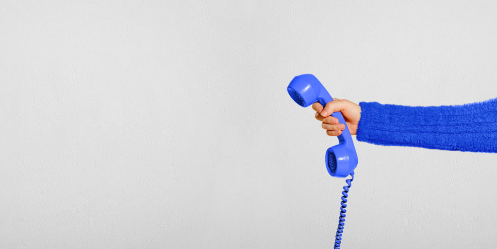 Hand holding blue phone